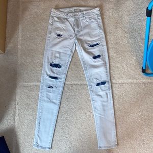 American Eagle light wash Hi-Rise Leggings. Super stretch. Denim colored rips.